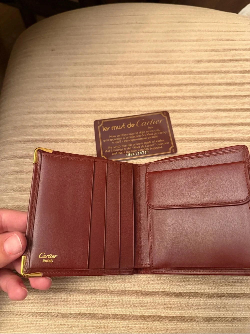 Cartier Burgundy Leather Bifold Wallet with Gold Corner Accents